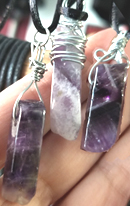Wire wrapped irregular rectangle Cape Amethyst, 1 inch to 1 1/4 inch on black cord