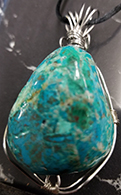 Wire wrapped Chrysocolla 1 1/2 x 7/8 pendant necklace on black cord