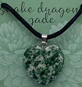 Passion snake dragon jade heart necklace on black cord.
