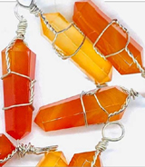 Carnelian wire wrapped pendant on cord 