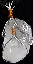 Clear quartz 1 1/2 inch crystal point wire wrapped in silver and copper on blak cord