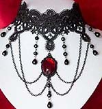Beaded choker with red pendant, chain