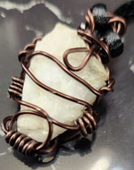 Quartz 1 1/4 in wire wrap necklace on cord