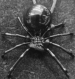 Spider with onyx body necklace on black satin cord